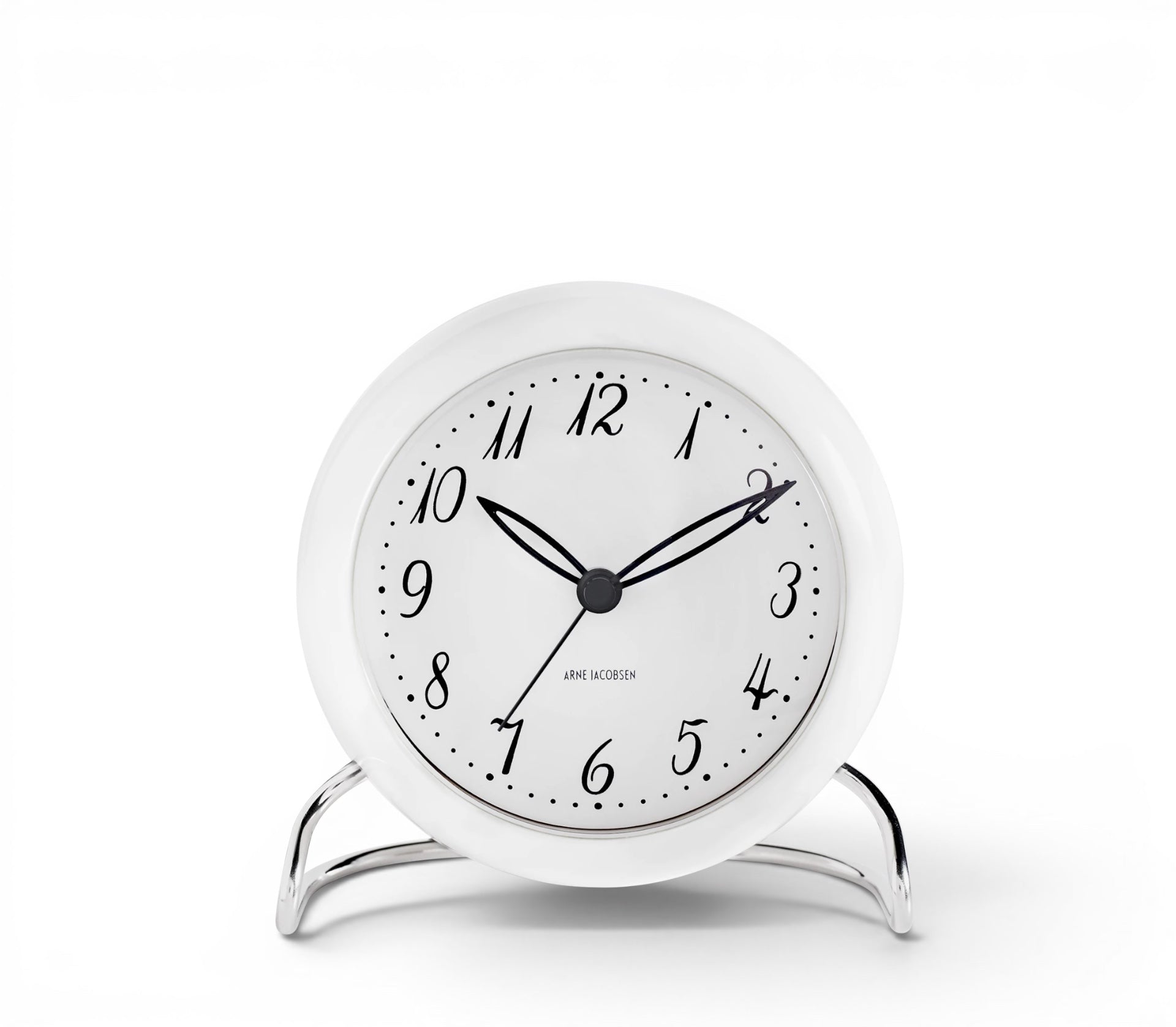hibino Arne Jacobsen white table clock with a minimalist dial and elegant metal stand on a white background