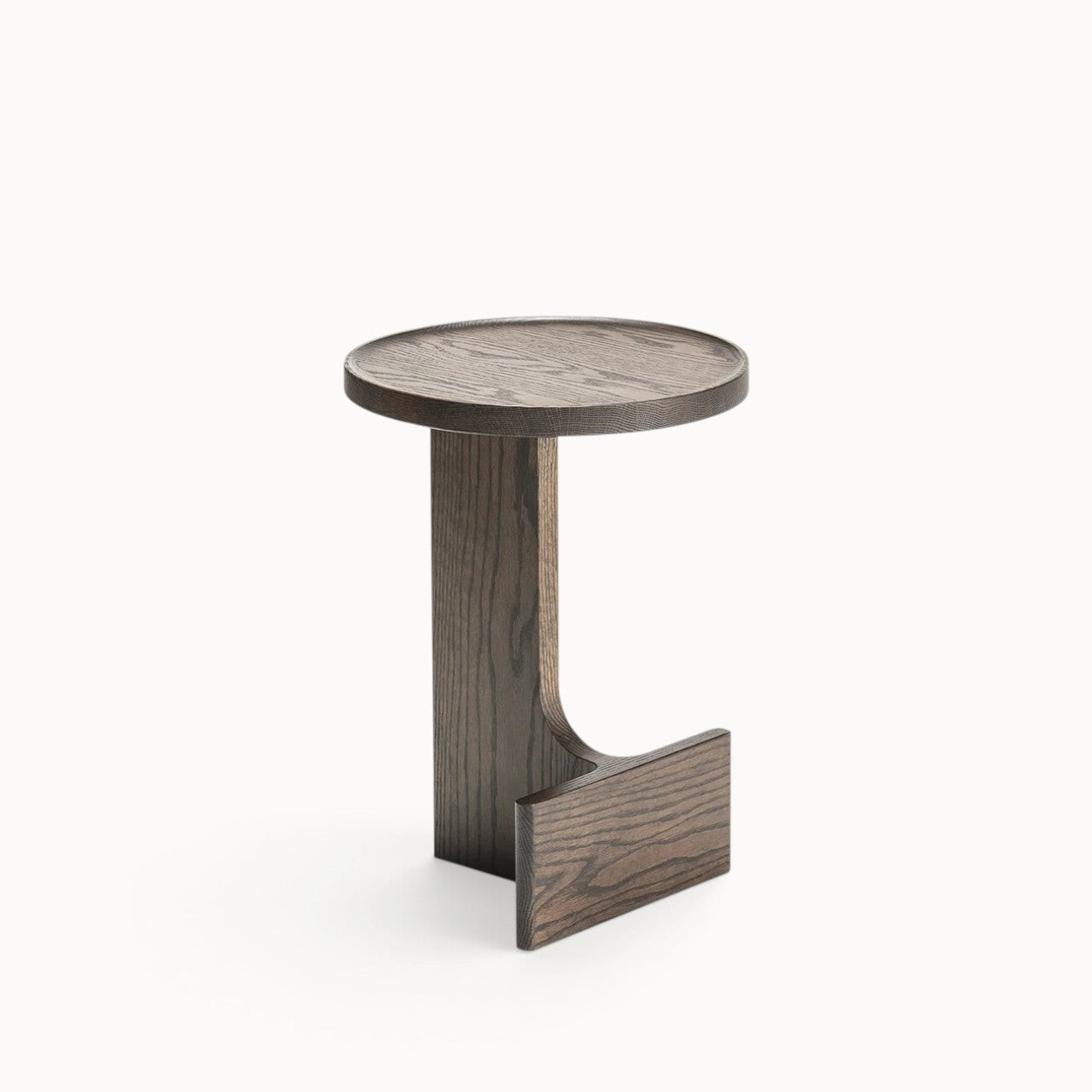 hibino Beam side table in dark stained wood with a sculptural, minimalist design and circular tabletop.