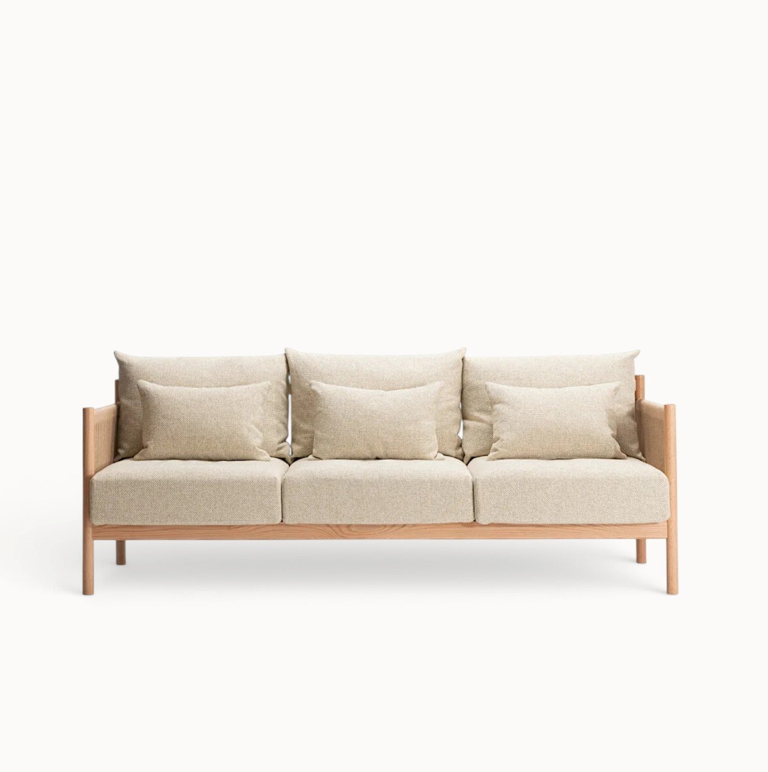 hibino Braid sofa with a light wood frame, woven paper cord armrests, and plush beige cushions in a lounge style.