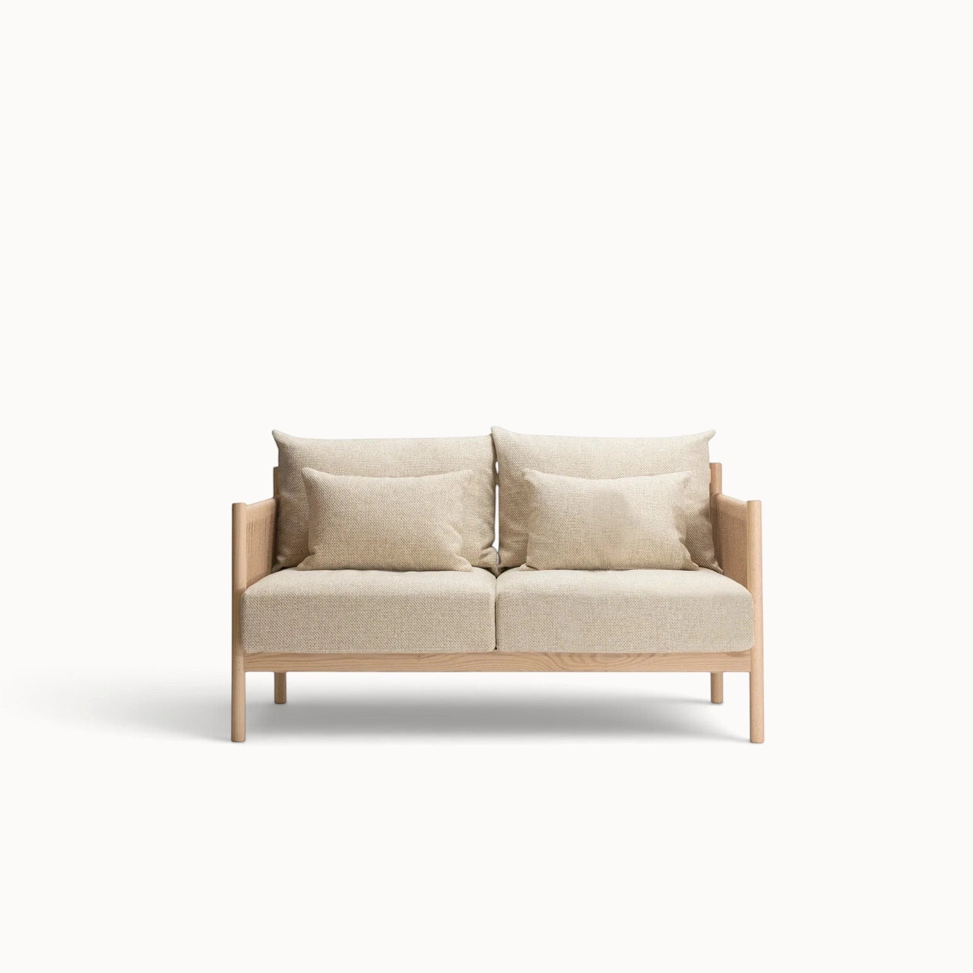 hibino Braid Sofa featuring a light wood frame with woven paper cord armrests and beige upholstered cushions.