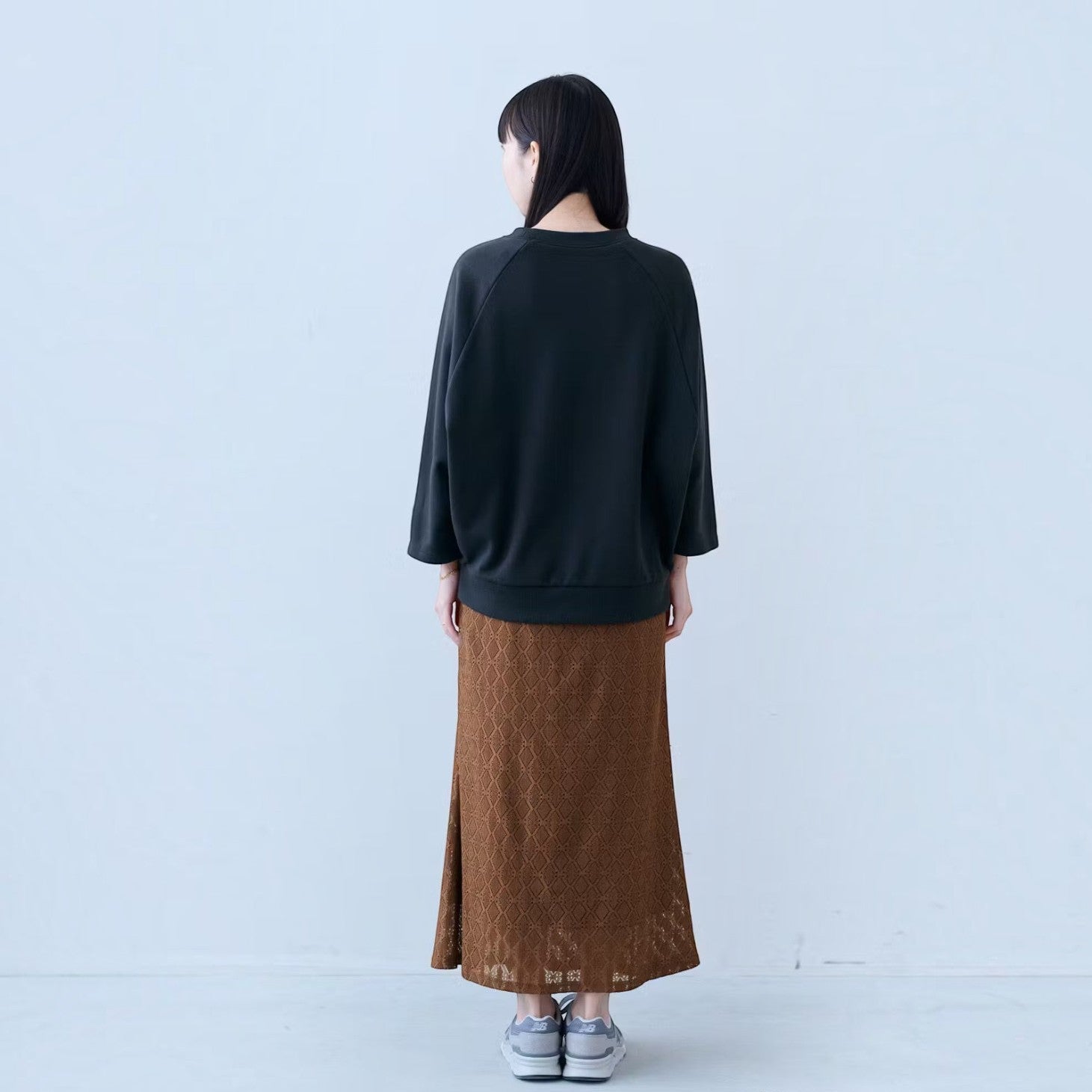 hibino charcoal black vintage-inspired MLB Cooperstown Collection sweatshirt with three-quarter sleeves on a woman