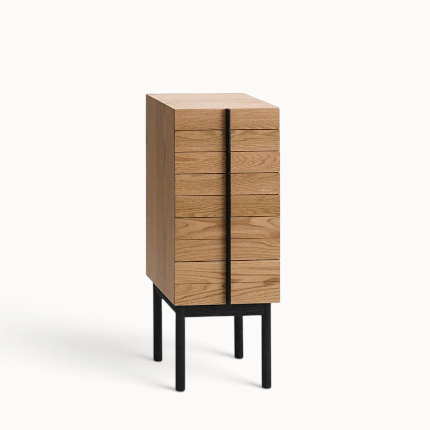 hibino Column Chest with light oak drawers and a vertical black handle detail on a raised black frame