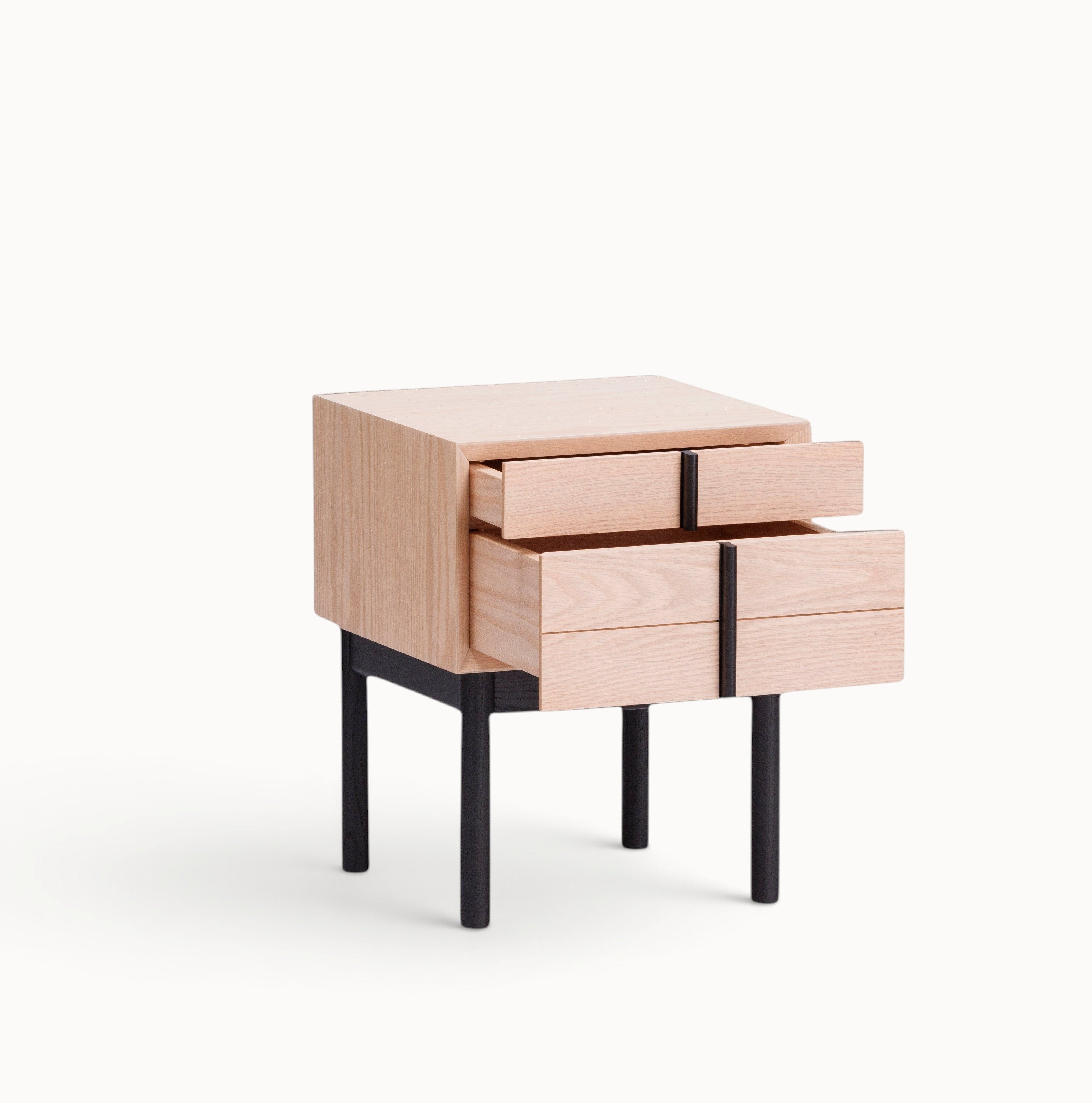 hibino Column Chest nightstand in light oak wood with two drawers and black metal legs on a white background