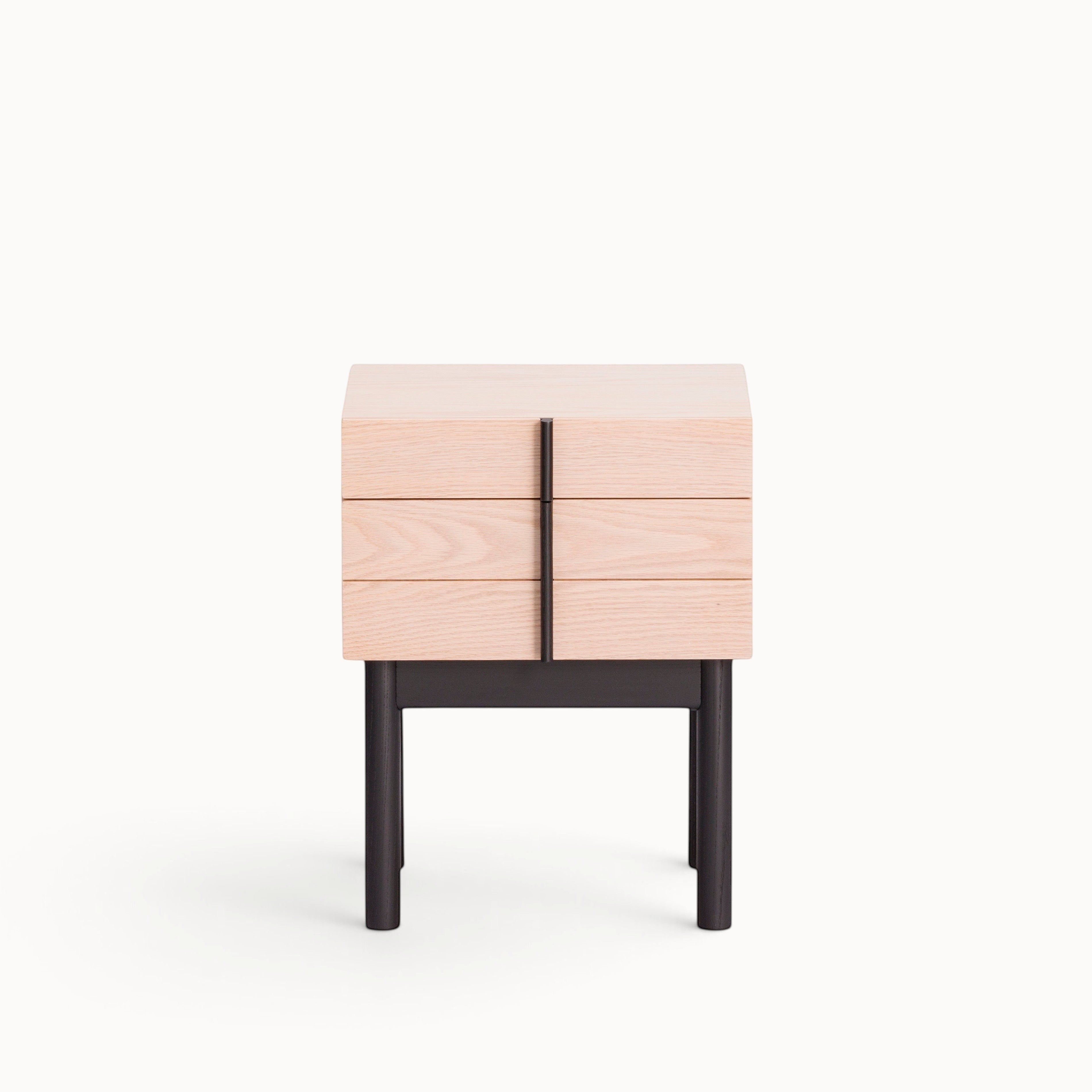 hibino Column Night Table in light wood with black legs and a vertical handle detail creating a clean aesthetic.