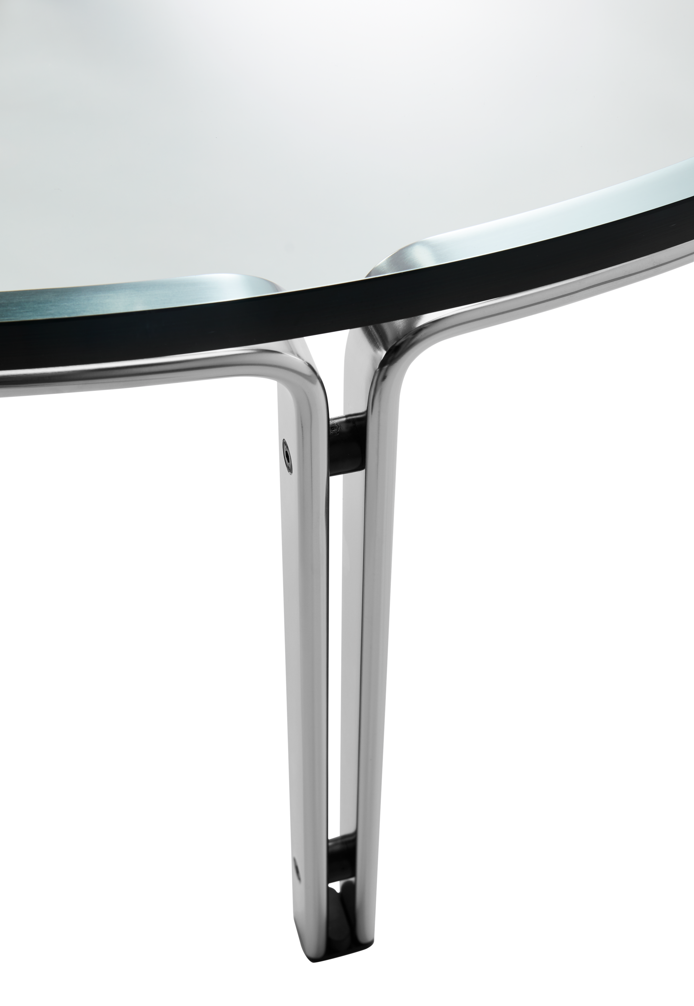 hibino FK110 round coffee table with a clear glass top and minimalist architectural steel frame detail