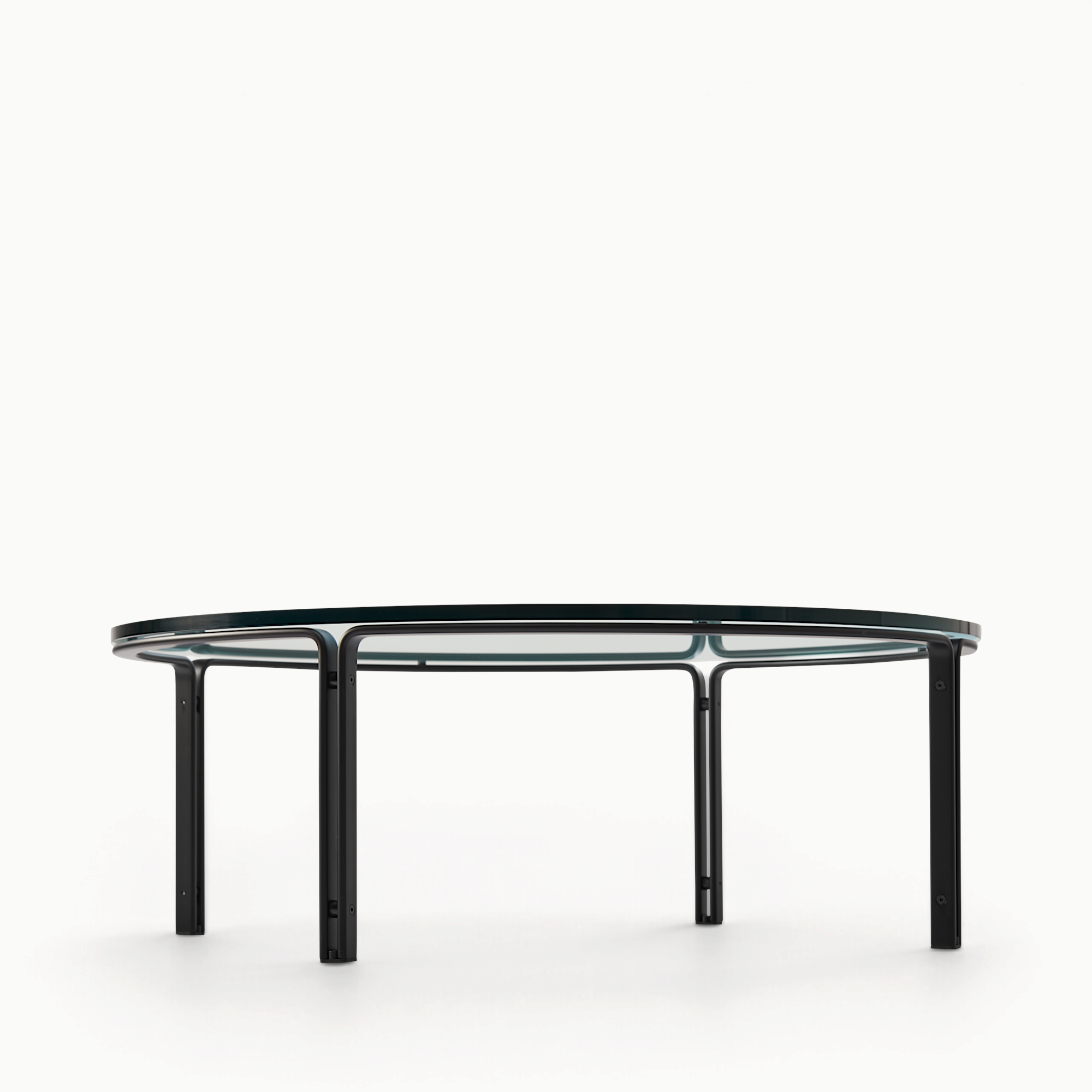 hibino FK110 round coffee table with a clear glass top and minimalist black steel frame in a modern architectural style