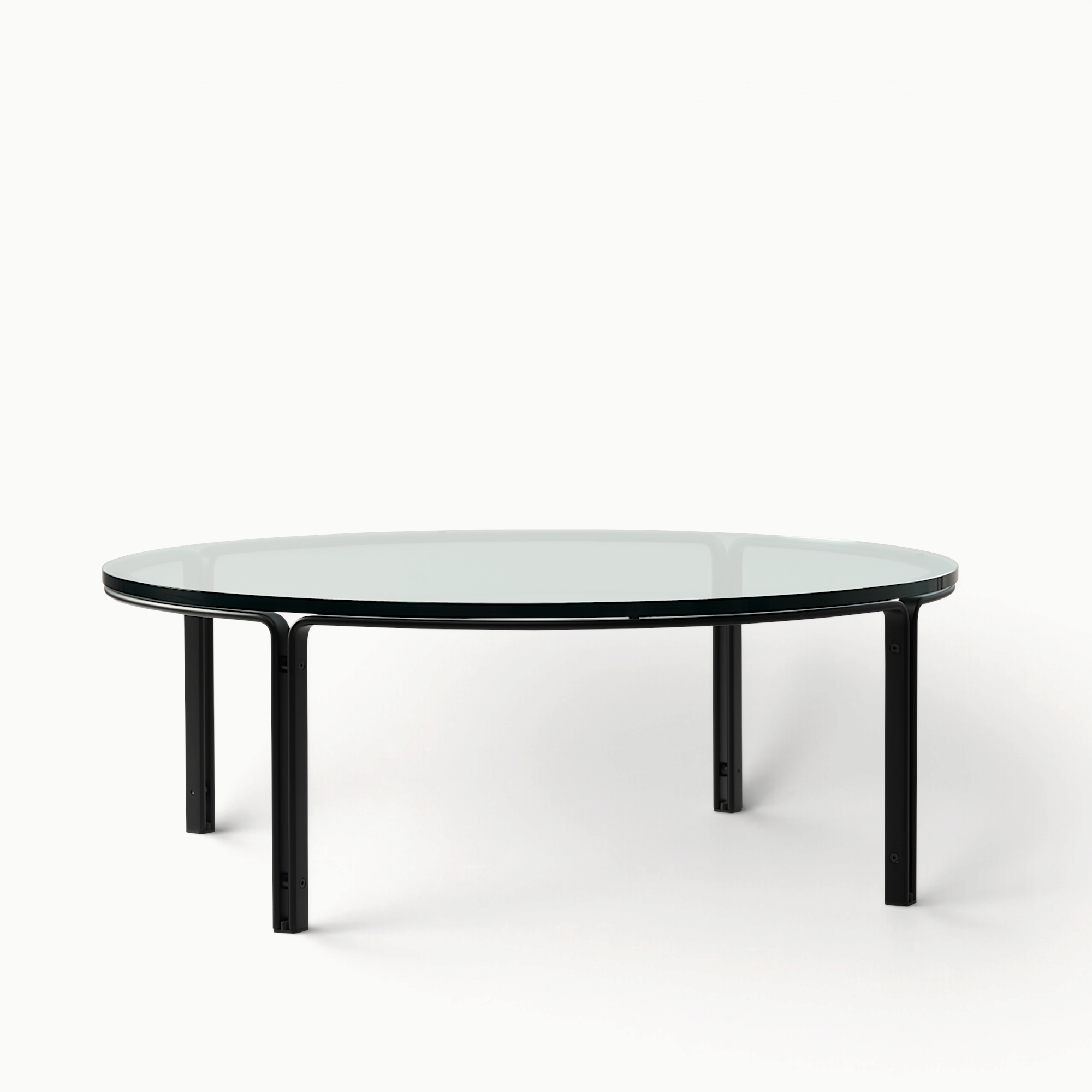 hibino FK110 round coffee table with a clear glass top and minimalist black steel frame in a mid-century style