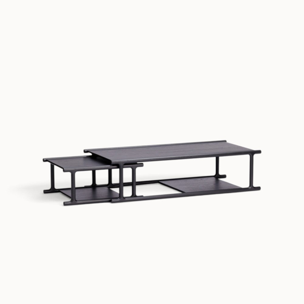 hibino Futago nesting coffee tables in black wood with a minimalist Japanese-inspired design and lower storage shelves