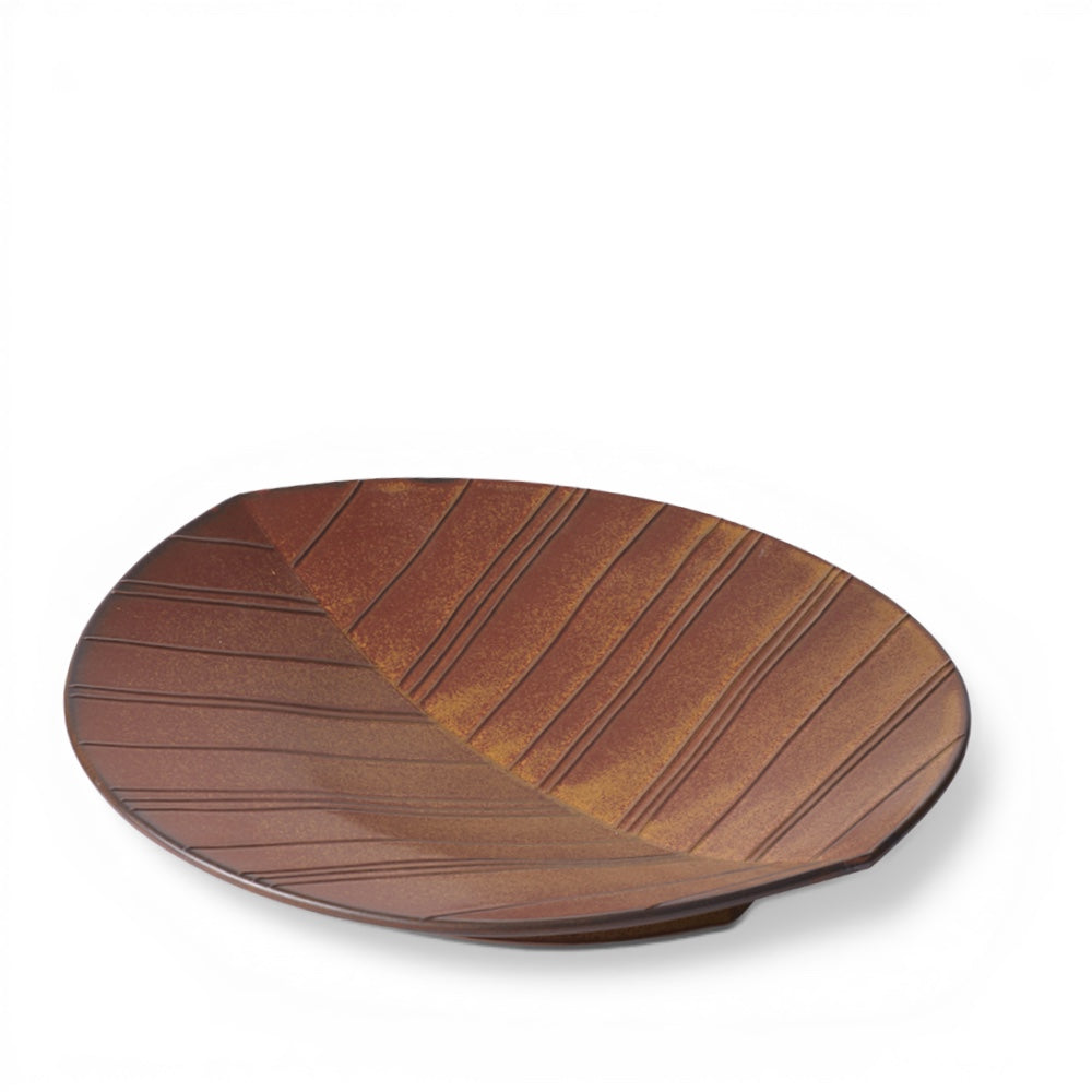 hibino Hazara leaf-shaped ceramic plate in earthy brown with subtle embossed lines, designed by Makoto Komatsu.