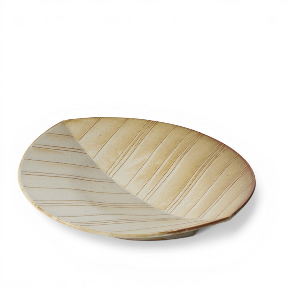 hibino Makoto Komatsu ceramic leaf-shaped plate in natural beige with subtle striped texture