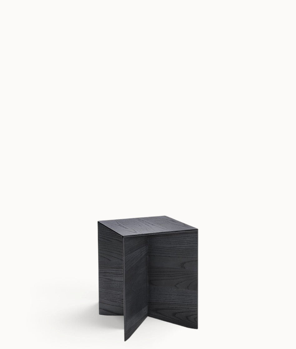 hibino Paperwood side table in black stained solid wood with a minimalist cross-base design and tapered edges.