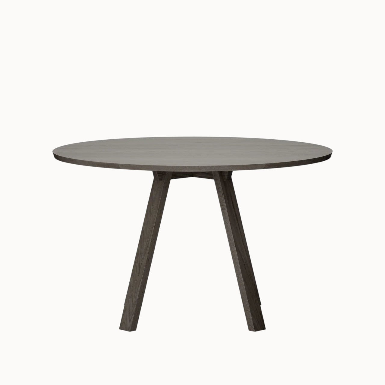 hibino Sagyo round wooden table in a dark oak finish with a minimalist design and angled legs