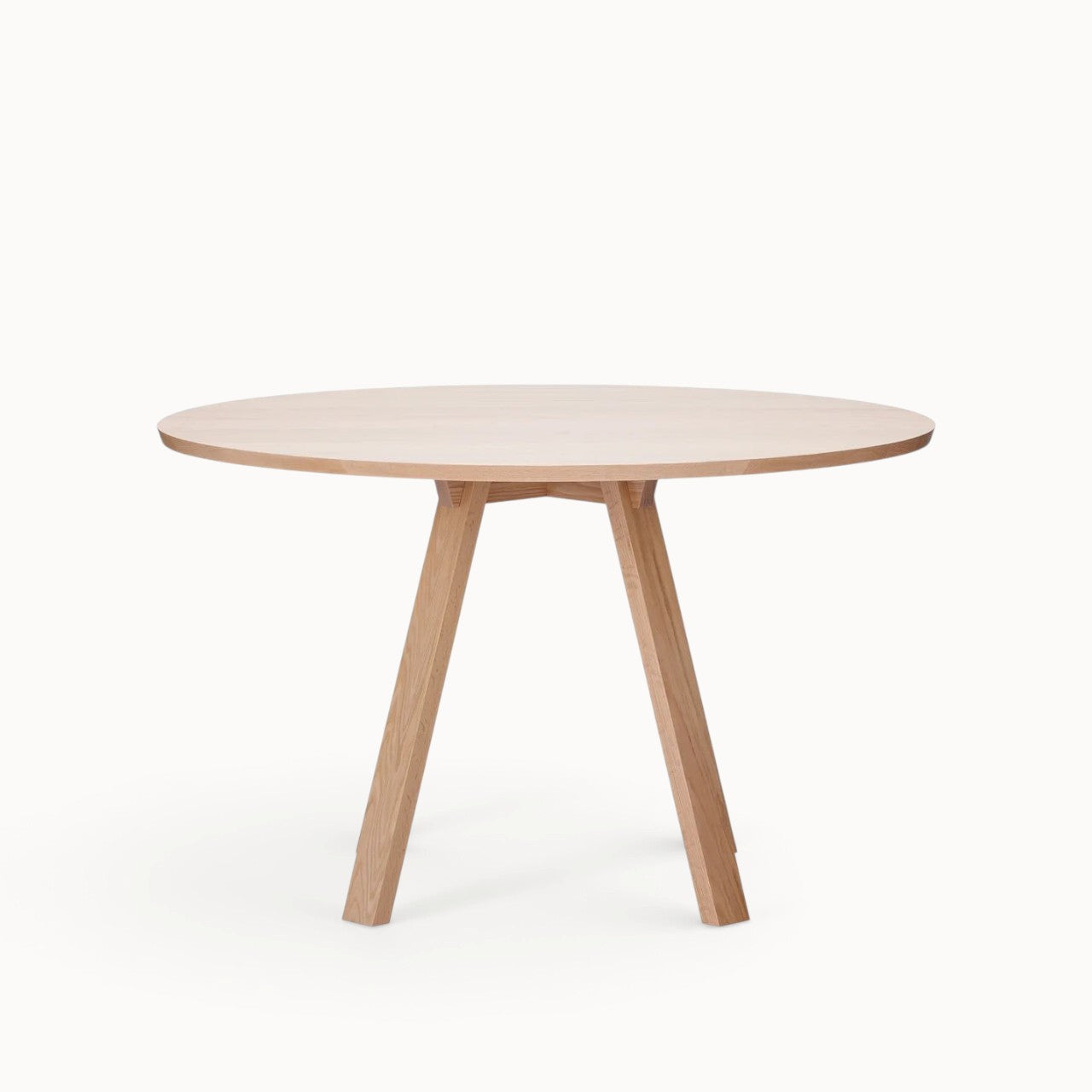 hibino Sagyo round table in natural oak wood with a minimalist design and split tabletop surface