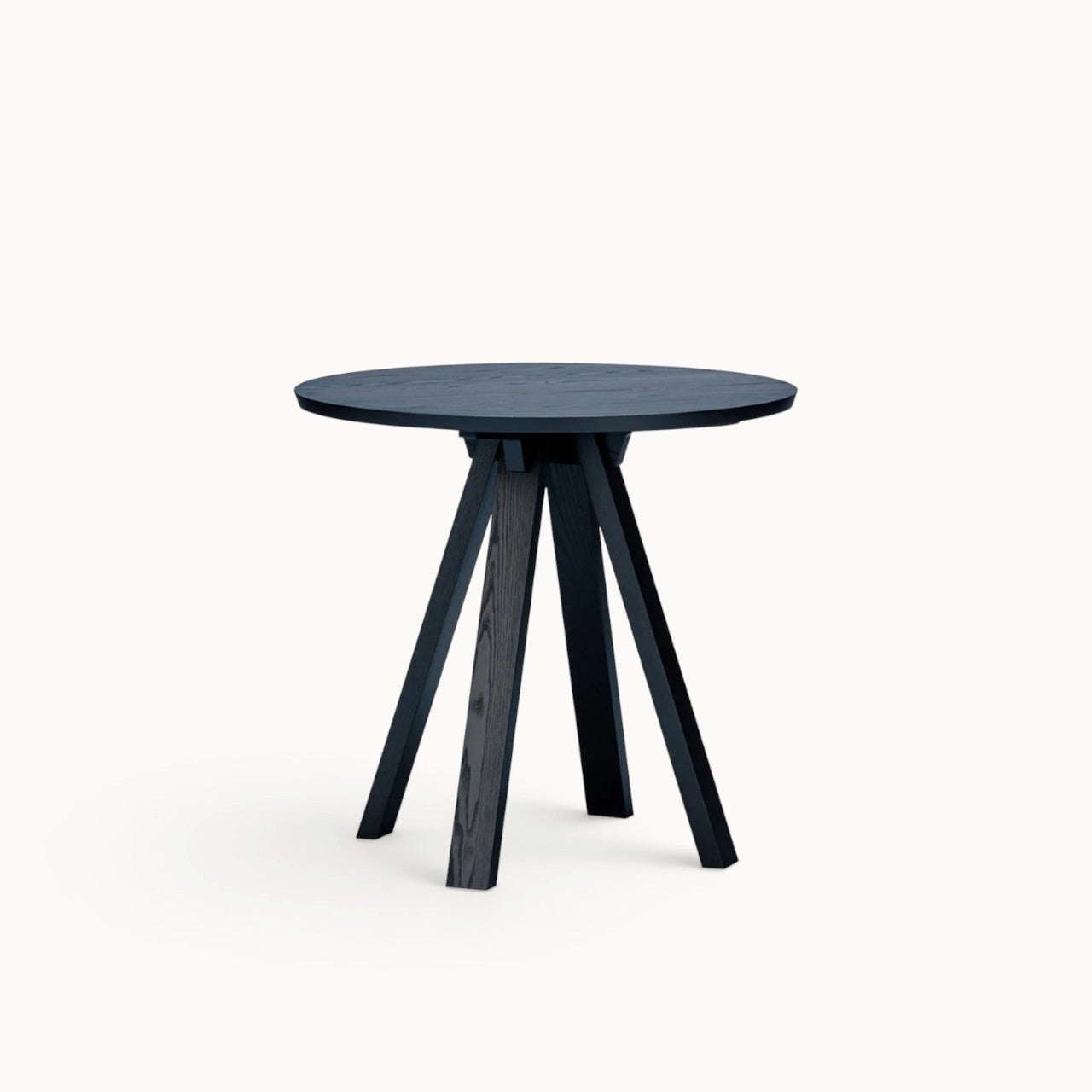 hibino Sagyo round table in black Sumi ash wood with a minimalist design and split tabletop surface