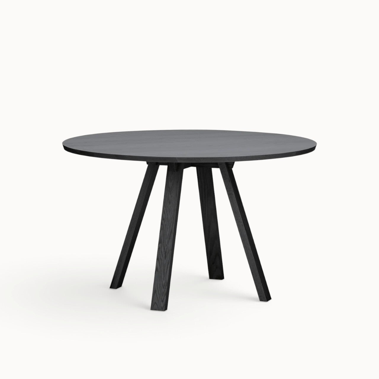 hibino Sagyo round table in dark Sumi ash wood finish with a minimalist design and central split tabletop detail.