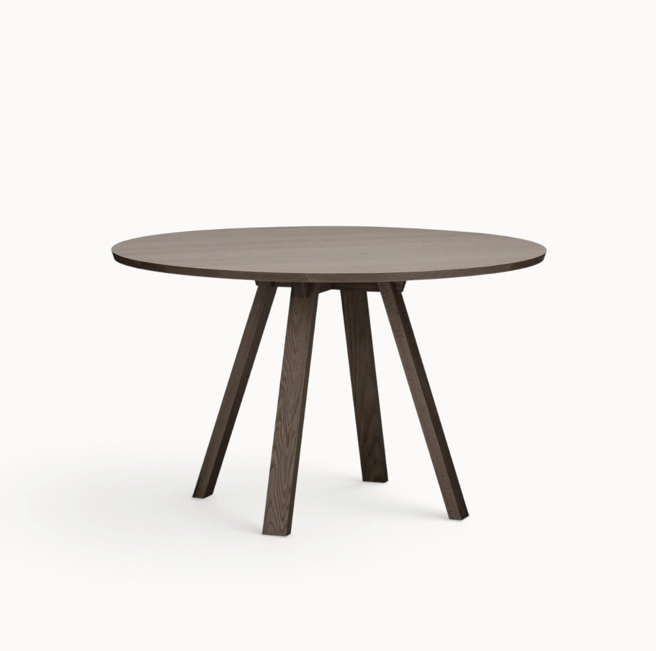 hibino Sagyo round table in dark wood finish with a minimalist design and angled legs on a white background