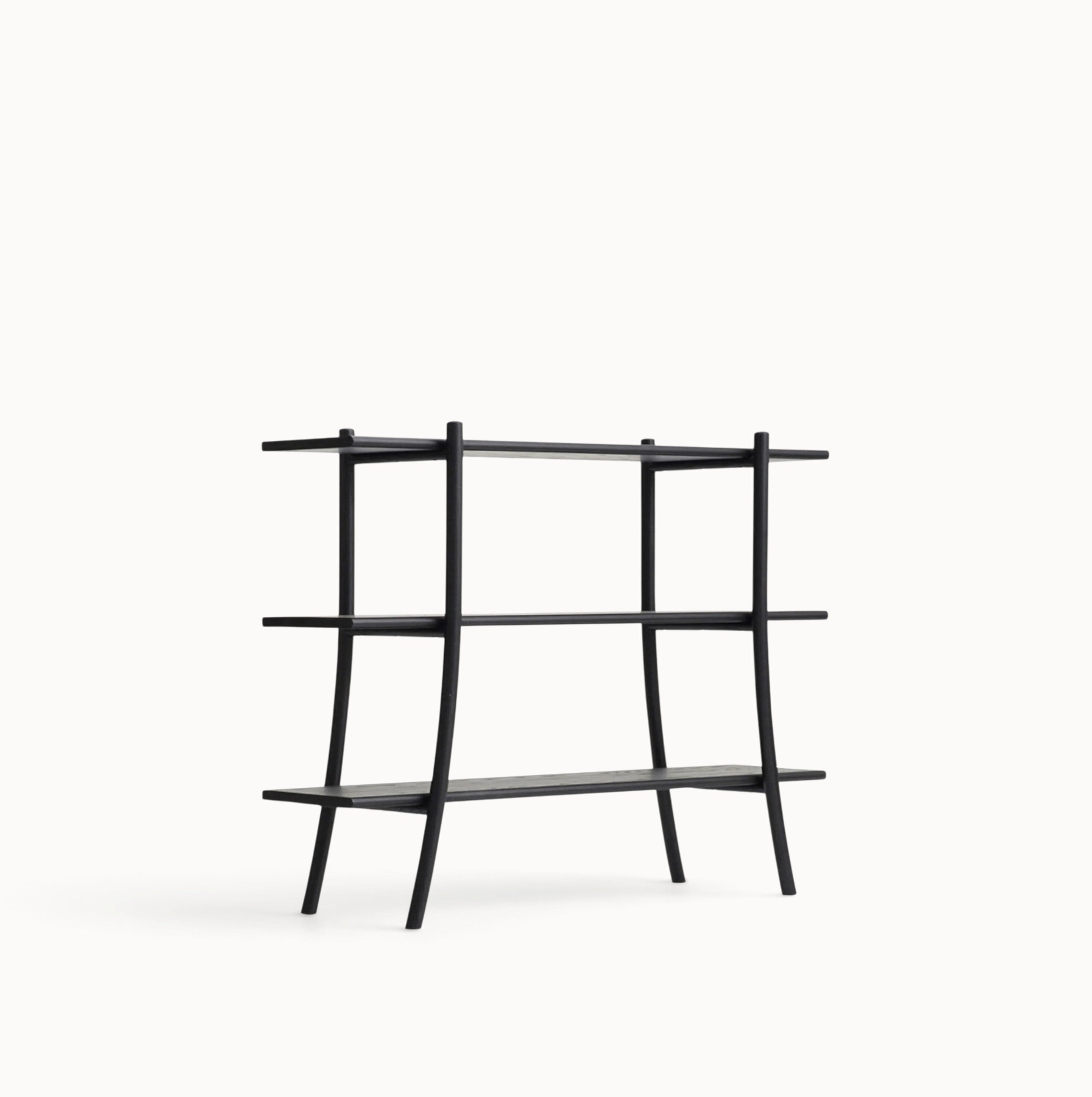 hibino Skyladder Shelves by Ariake featuring a minimalist black wooden design with curved ladder-like legs.