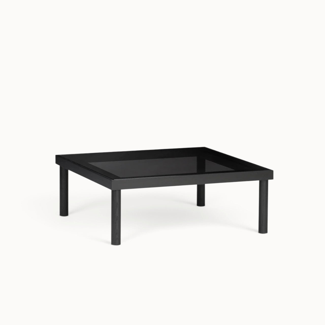 hibino Taruki coffee table with a black wooden frame and a smoked glass top, inspired by Japanese joinery.