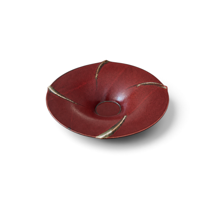 hibino rust-red ceramic bowl with a sculptural petal-like shape and textured glaze finish